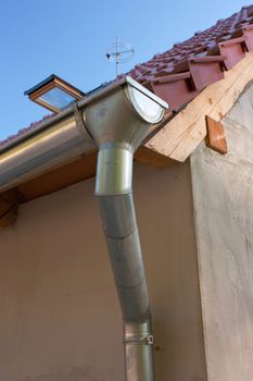 Groove, pipe and roof of a new residence