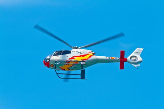 CADIZ, SPAIN-SEP 11: Helicopters of the Patrulla Aspa taking part in an exhibition on the 4th airshow of Cadiz on Sep 11, 2011, in Cadiz, Spain