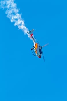 CADIZ, SPAIN-SEP 11: Helicopters of the Patrulla Aspa taking part in an exhibition on the 4th airshow of Cadiz on Sep 11, 2011, in Cadiz, Spain