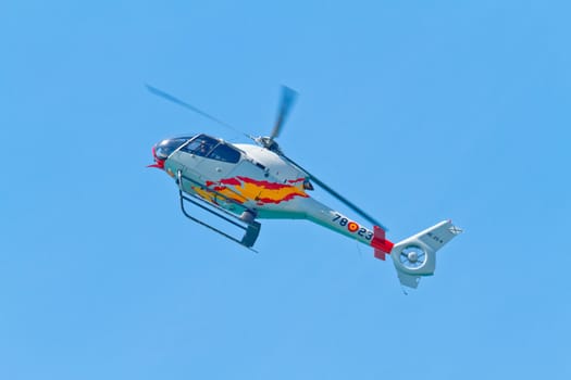 CADIZ, SPAIN-SEP 11: Helicopters of the Patrulla Aspa taking part in an exhibition on the 4th airshow of Cadiz on Sep 11, 2011, in Cadiz, Spain