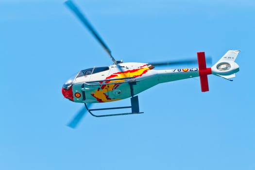 CADIZ, SPAIN-SEP 11: Helicopters of the Patrulla Aspa taking part in an exhibition on the 4th airshow of Cadiz on Sep 11, 2011, in Cadiz, Spain