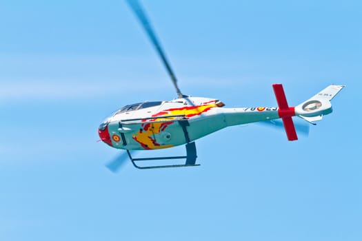CADIZ, SPAIN-SEP 11: Helicopters of the Patrulla Aspa taking part in an exhibition on the 4th airshow of Cadiz on Sep 11, 2011, in Cadiz, Spain