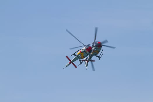 CADIZ, SPAIN-SEP 11: Helicopters of the Patrulla Aspa taking part in an exhibition on the 4th airshow of Cadiz on Sep 11, 2011, in Cadiz, Spain