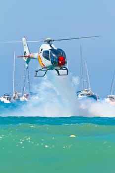 CADIZ, SPAIN-SEP 11: Helicopters of the Patrulla Aspa taking part in an exhibition on the 4th airshow of Cadiz on Sep 11, 2011, in Cadiz, Spain