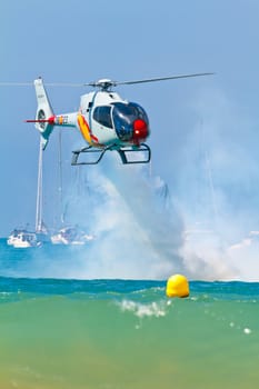 CADIZ, SPAIN-SEP 11: Helicopters of the Patrulla Aspa taking part in an exhibition on the 4th airshow of Cadiz on Sep 11, 2011, in Cadiz, Spain