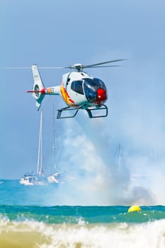 CADIZ, SPAIN-SEP 11: Helicopters of the Patrulla Aspa taking part in an exhibition on the 4th airshow of Cadiz on Sep 11, 2011, in Cadiz, Spain