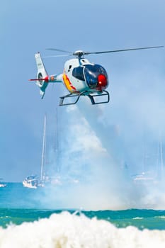 CADIZ, SPAIN-SEP 11: Helicopters of the Patrulla Aspa taking part in an exhibition on the 4th airshow of Cadiz on Sep 11, 2011, in Cadiz, Spain