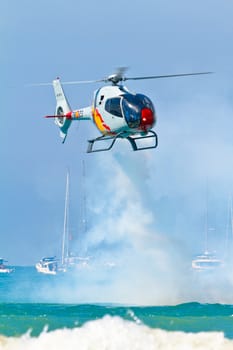 CADIZ, SPAIN-SEP 11: Helicopters of the Patrulla Aspa taking part in an exhibition on the 4th airshow of Cadiz on Sep 11, 2011, in Cadiz, Spain