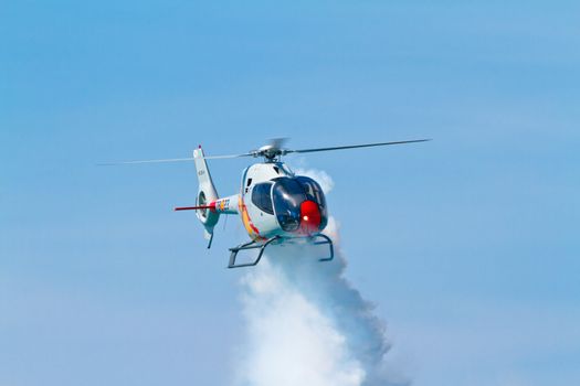 CADIZ, SPAIN-SEP 11: Helicopters of the Patrulla Aspa taking part in an exhibition on the 4th airshow of Cadiz on Sep 11, 2011, in Cadiz, Spain
