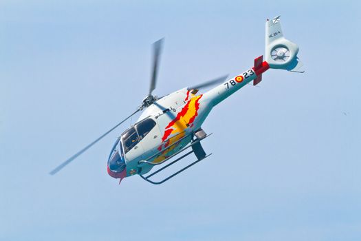 CADIZ, SPAIN-SEP 11: Helicopters of the Patrulla Aspa taking part in an exhibition on the 4th airshow of Cadiz on Sep 11, 2011, in Cadiz, Spain