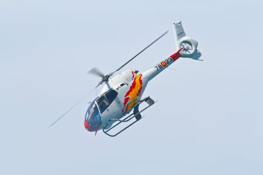 CADIZ, SPAIN-SEP 11: Helicopters of the Patrulla Aspa taking part in an exhibition on the 4th airshow of Cadiz on Sep 11, 2011, in Cadiz, Spain