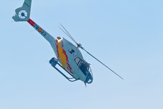 CADIZ, SPAIN-SEP 11: Helicopters of the Patrulla Aspa taking part in an exhibition on the 4th airshow of Cadiz on Sep 11, 2011, in Cadiz, Spain