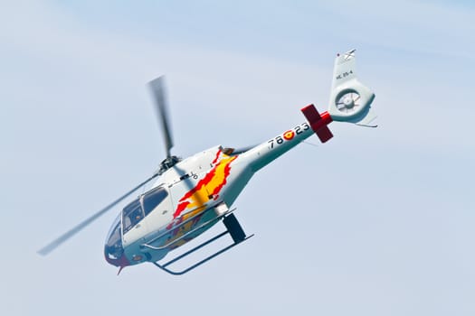 CADIZ, SPAIN-SEP 11: Helicopters of the Patrulla Aspa taking part in an exhibition on the 4th airshow of Cadiz on Sep 11, 2011, in Cadiz, Spain