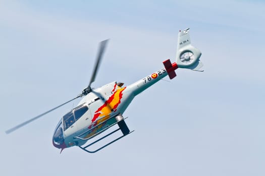 CADIZ, SPAIN-SEP 11: Helicopters of the Patrulla Aspa taking part in an exhibition on the 4th airshow of Cadiz on Sep 11, 2011, in Cadiz, Spain