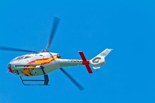 CADIZ, SPAIN-SEP 11: Helicopters of the Patrulla Aspa taking part in an exhibition on the 4th airshow of Cadiz on Sep 11, 2011, in Cadiz, Spain