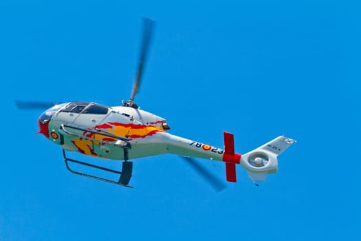 CADIZ, SPAIN-SEP 11: Helicopters of the Patrulla Aspa taking part in an exhibition on the 4th airshow of Cadiz on Sep 11, 2011, in Cadiz, Spain