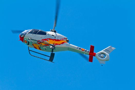 CADIZ, SPAIN-SEP 11: Helicopters of the Patrulla Aspa taking part in an exhibition on the 4th airshow of Cadiz on Sep 11, 2011, in Cadiz, Spain