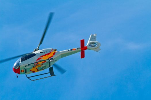 CADIZ, SPAIN-SEP 11: Helicopters of the Patrulla Aspa taking part in an exhibition on the 4th airshow of Cadiz on Sep 11, 2011, in Cadiz, Spain