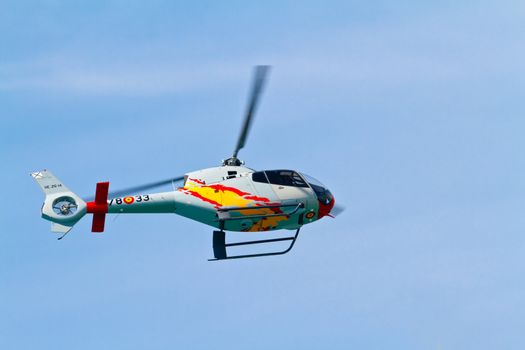 CADIZ, SPAIN-SEP 11: Helicopters of the Patrulla Aspa taking part in an exhibition on the 4th airshow of Cadiz on Sep 11, 2011, in Cadiz, Spain