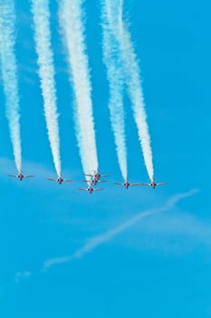 CADIZ, SPAIN-SEP 11: Aircrafts of the Patrulla Aguila taking part in an exhibition on the 4th airshow of Cadiz on Sep 11, 2011, in Cadiz, Spain