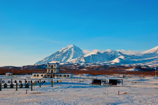 Military training base against a volcano in Russia