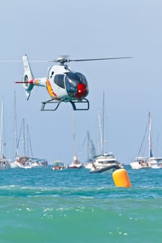 CADIZ, SPAIN-SEP 11: Helicopters of the Patrulla Aspa taking part in an exhibition on the 4th airshow of Cadiz on Sep 11, 2011, in Cadiz, Spain