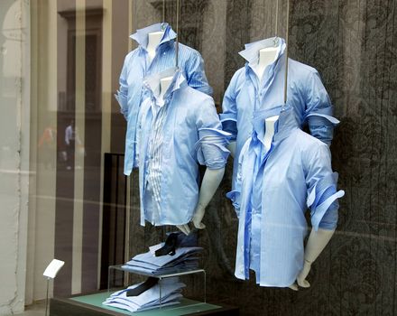 various  blue men's shirt in shop window