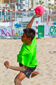 CADIZ, SPAIN - JULY 19: Unidentified players compete in a match between Zonabalonmano.com and BMPY Los Coñetas in the 19th league of beach handball of Cadiz on July 19, 2011 in Cadiz, Spain
