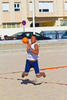 CADIZ, SPAIN - JULY 19: Unidentified players compete in a match between Autoescuela Barquin and CadizSur Seguros BMPY in the 19th league of beach handball of Cadiz on July 19, 2011 in Cadiz, Spain