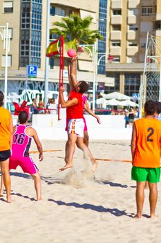 CADIZ, SPAIN - JULY 19: Unidentified players compete in a match between Autoescuela Barquin and CadizSur Seguros BMPY in the 19th league of beach handball of Cadiz on July 19, 2011 in Cadiz, Spain