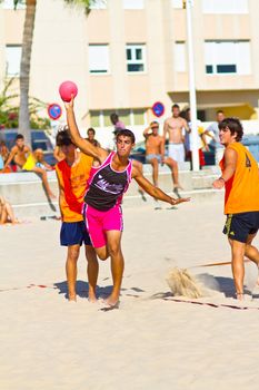 CADIZ, SPAIN - JULY 19: Unidentified players compete in a match between Autoescuela Barquin and CadizSur Seguros BMPY in the 19th league of beach handball of Cadiz on July 19, 2011 in Cadiz, Spain