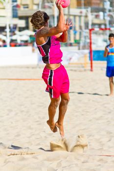 CADIZ, SPAIN - JULY 19: Unidentified players compete in a match between Autoescuela Barquin and CadizSur Seguros BMPY in the 19th league of beach handball of Cadiz on July 19, 2011 in Cadiz, Spain