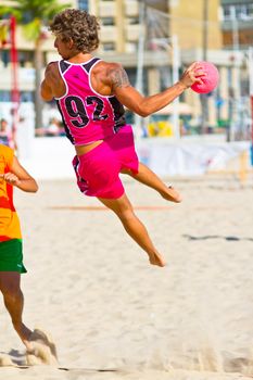 CADIZ, SPAIN - JULY 19: Unidentified players compete in a match between Autoescuela Barquin and CadizSur Seguros BMPY in the 19th league of beach handball of Cadiz on July 19, 2011 in Cadiz, Spain