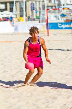 CADIZ, SPAIN - JULY 19: Unidentified players compete in a match between Autoescuela Barquin and CadizSur Seguros BMPY in the 19th league of beach handball of Cadiz on July 19, 2011 in Cadiz, Spain