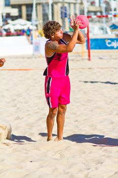 CADIZ, SPAIN - JULY 19: Unidentified players compete in a match between Autoescuela Barquin and CadizSur Seguros BMPY in the 19th league of beach handball of Cadiz on July 19, 2011 in Cadiz, Spain