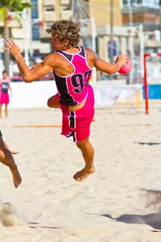 CADIZ, SPAIN - JULY 19: Unidentified players compete in a match between Autoescuela Barquin and CadizSur Seguros BMPY in the 19th league of beach handball of Cadiz on July 19, 2011 in Cadiz, Spain