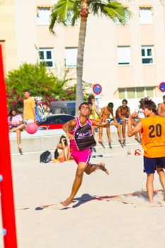 CADIZ, SPAIN - JULY 19: Unidentified players compete in a match between Autoescuela Barquin and CadizSur Seguros BMPY in the 19th league of beach handball of Cadiz on July 19, 2011 in Cadiz, Spain