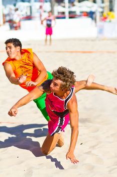 CADIZ, SPAIN - JULY 19: Unidentified players compete in a match between Autoescuela Barquin and CadizSur Seguros BMPY in the 19th league of beach handball of Cadiz on July 19, 2011 in Cadiz, Spain