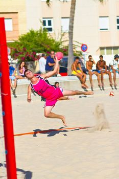 CADIZ, SPAIN - JULY 19: Unidentified players compete in a match between Autoescuela Barquin and CadizSur Seguros BMPY in the 19th league of beach handball of Cadiz on July 19, 2011 in Cadiz, Spain