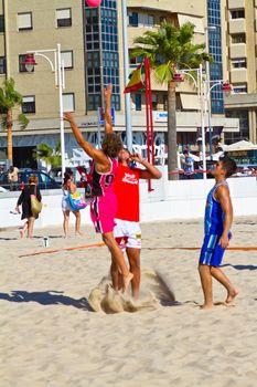 CADIZ, SPAIN - JULY 19: Unidentified players compete in a match between Autoescuela Barquin and CadizSur Seguros BMPY in the 19th league of beach handball of Cadiz on July 19, 2011 in Cadiz, Spain