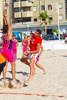 CADIZ, SPAIN - JULY 19: Unidentified players compete in a match between Autoescuela Barquin and CadizSur Seguros BMPY in the 19th league of beach handball of Cadiz on July 19, 2011 in Cadiz, Spain