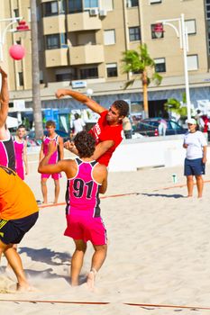 CADIZ, SPAIN - JULY 19: Unidentified players compete in a match between Autoescuela Barquin and CadizSur Seguros BMPY in the 19th league of beach handball of Cadiz on July 19, 2011 in Cadiz, Spain