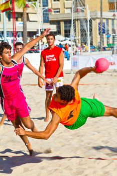 CADIZ, SPAIN - JULY 19: Unidentified players compete in a match between Autoescuela Barquin and CadizSur Seguros BMPY in the 19th league of beach handball of Cadiz on July 19, 2011 in Cadiz, Spain