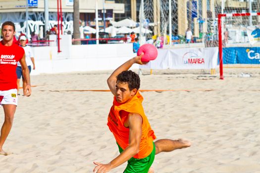 CADIZ, SPAIN - JULY 19: Unidentified players compete in a match between Autoescuela Barquin and CadizSur Seguros BMPY in the 19th league of beach handball of Cadiz on July 19, 2011 in Cadiz, Spain