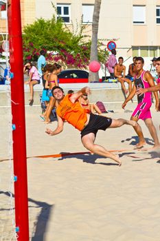 CADIZ, SPAIN - JULY 19: Unidentified players compete in a match between Autoescuela Barquin and CadizSur Seguros BMPY in the 19th league of beach handball of Cadiz on July 19, 2011 in Cadiz, Spain