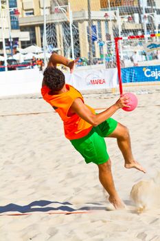 CADIZ, SPAIN - JULY 19: Unidentified players compete in a match between Autoescuela Barquin and CadizSur Seguros BMPY in the 19th league of beach handball of Cadiz on July 19, 2011 in Cadiz, Spain