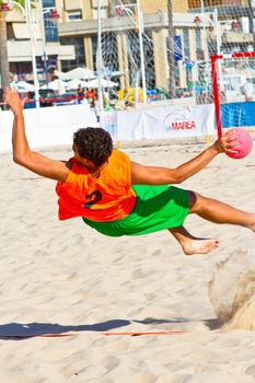 CADIZ, SPAIN - JULY 19: Unidentified players compete in a match between Autoescuela Barquin and CadizSur Seguros BMPY in the 19th league of beach handball of Cadiz on July 19, 2011 in Cadiz, Spain