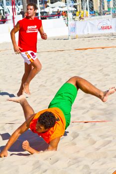 CADIZ, SPAIN - JULY 19: Unidentified players compete in a match between Autoescuela Barquin and CadizSur Seguros BMPY in the 19th league of beach handball of Cadiz on July 19, 2011 in Cadiz, Spain