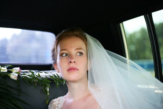 Beautiful the bride in car