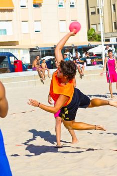 CADIZ, SPAIN - JULY 19: Unidentified players compete in a match between Autoescuela Barquin and CadizSur Seguros BMPY in the 19th league of beach handball of Cadiz on July 19, 2011 in Cadiz, Spain
